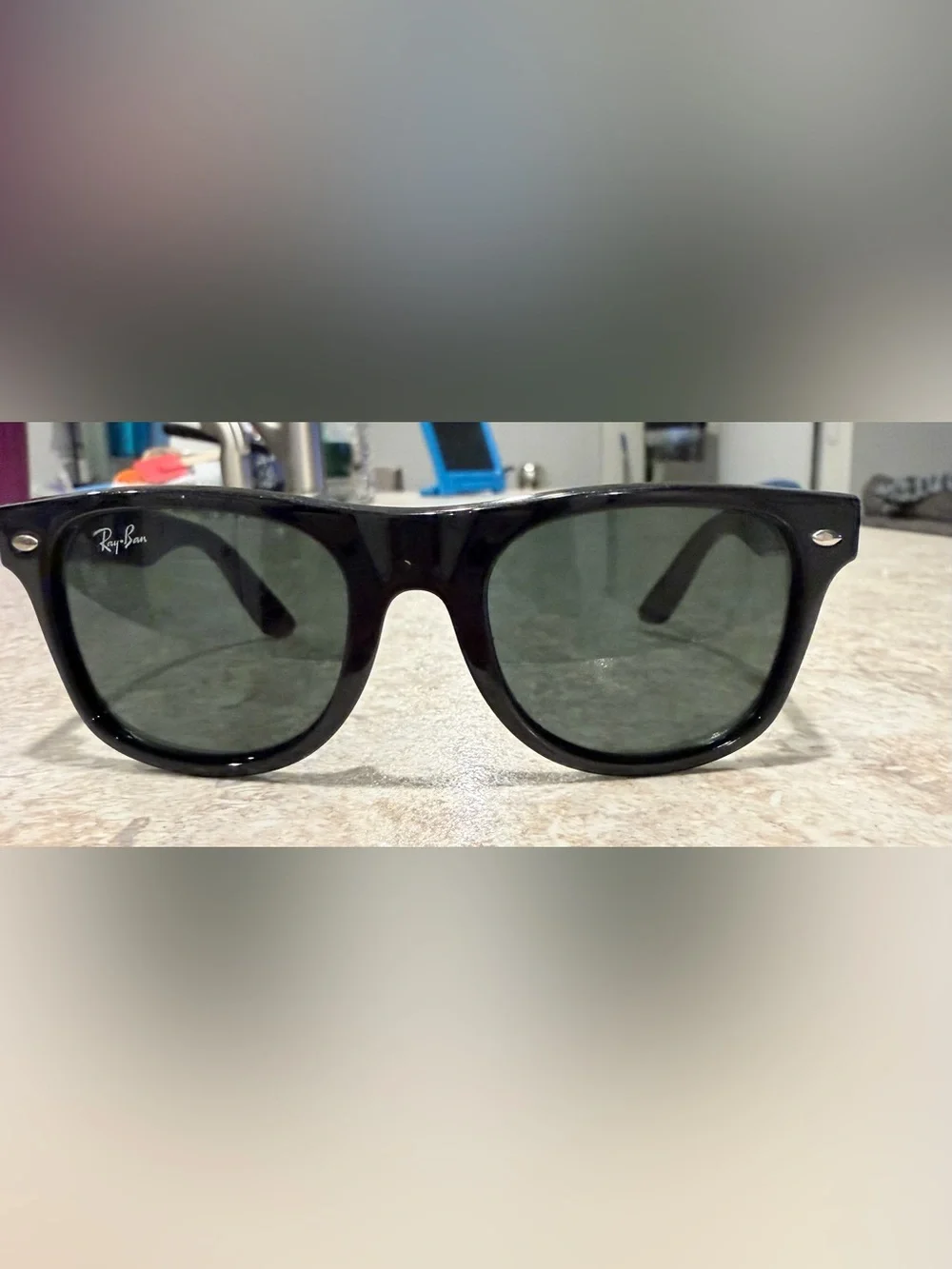 Ray-Ban RB9035S Kids sunglasses featuring a black frame and distinctive green